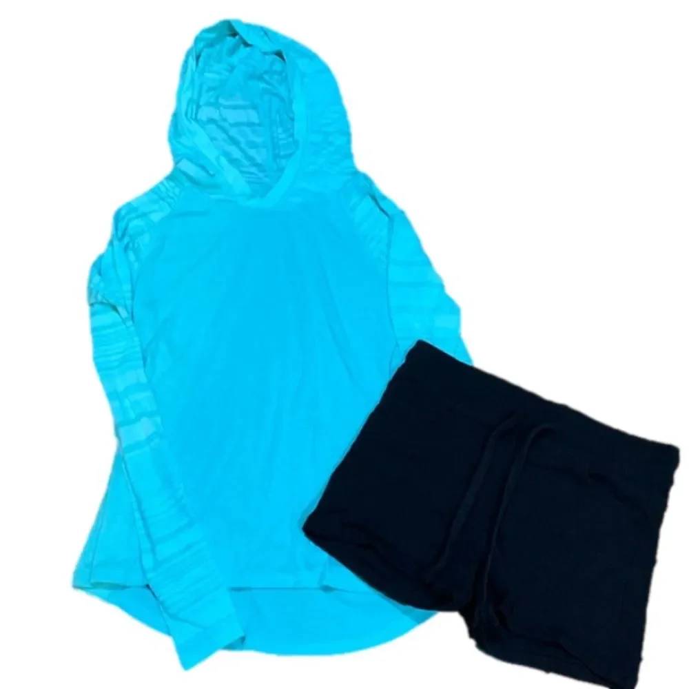 Girls small teal hooded shirt with black small stretchy shorts in box 11